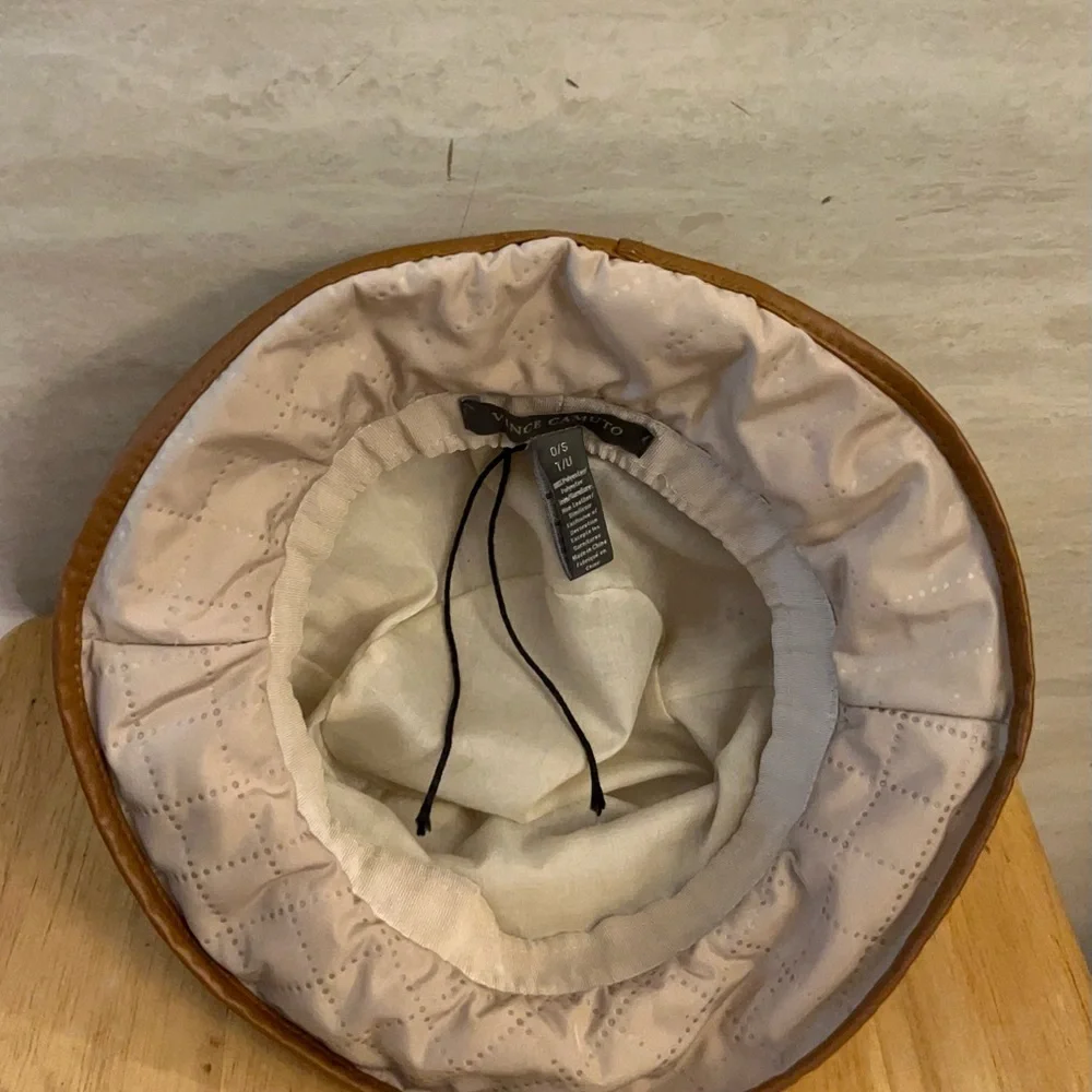 Vince Camuto Quilted Cream Bucket Hat with Tan Trim and Gold Emblem